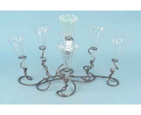 A late 19th Century seven branch plated epergne with six clear and one vaseline glass flutes