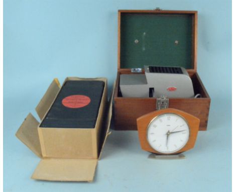 A cased Gnome Aplax II slide projector (untested) together with a vintage Johnson Exactum post card enlarge and a Metamec ele