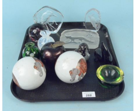 A tray of mixed glass animal paperweights etc together with a pair of ceramic balls decorated with elephants
