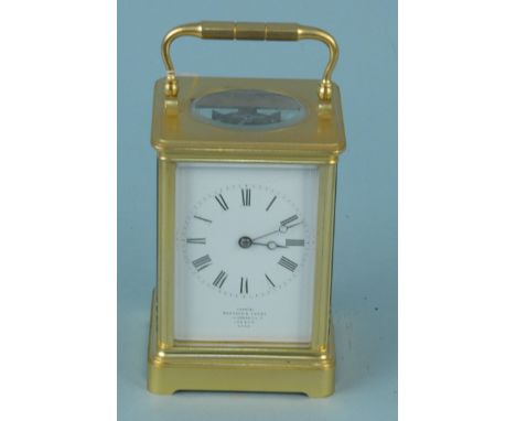 An early 20th Century brass carriage clock with key, dial marked 'Examined by Barraudx Lunds, I.Cornhill London 4396'