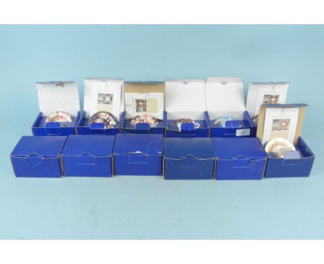 A set of twelve Royal Worcester boxed cups and saucers from the miniature collection