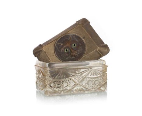 LATE VICTORIAN TRINKET BOX, CIRCA 1900 the silver plated cover with well-detailed cat's face in relief set with glass eyes, r