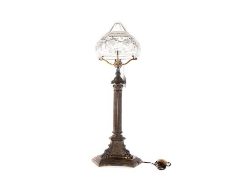 GEORGE V SILVER TABLE LAMP, WALKER & HALL, SHEFFIELD 1911 with shaped clear cut glass shade on Corinthian column stem to shap