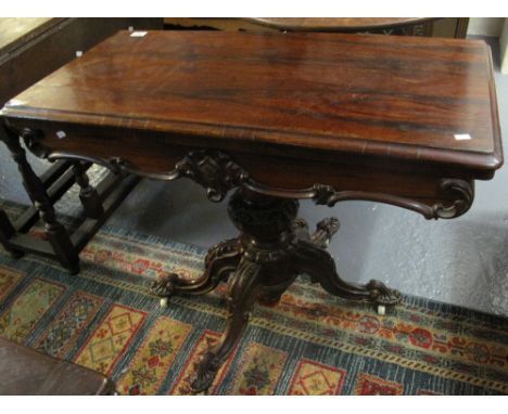 19th Century rosewood card table on carved pedestal quatreform base and casters. (B.P. 24% incl. VAT)