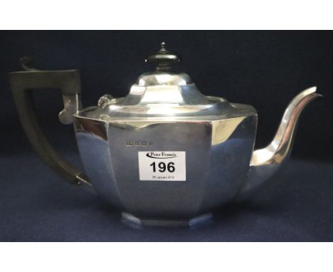 Silver baluster shaped octagonal section teapot in Georgian style with ebony handle and finial. Birmingham hallmarks for 1932