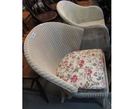 Two similar lloyd loom style wicker armchairs. (B.P. 24% incl. VAT)