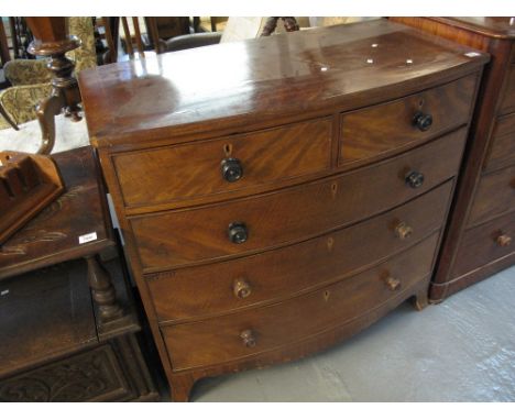 Early Victorian mahogany bow fronted chest of two short and three long cock beaded drawers on splayed bracket feet. (B.P. 24%