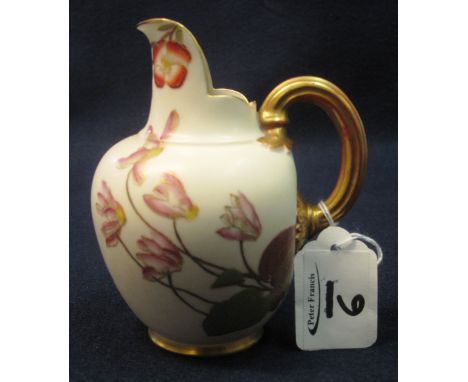 A Royal Worcester porcelain helmet shaped baluster jug with painted and gilded foliate decoration and gilded loop handle, pri