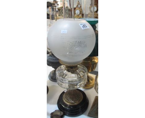 Double burner oil lamp with globular shade together with a smaller single burner oil lamp on a cast metal base (2).(B.P. 24% 