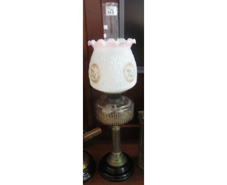 Early 20th century double burner oil lamp with floral opaline glass frilled shade, clear reservoir on a brass pedestal and st
