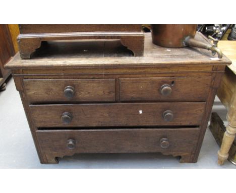 19th Century low oak straight front chest of two short and two long drawers on bracket feet. (B.P. 24% incl. VAT)