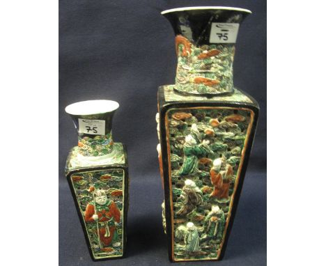 Two Chinese porcelain, tapered, square section pierced and moulded vases, depicting immortals amongst clouds. Both in famille