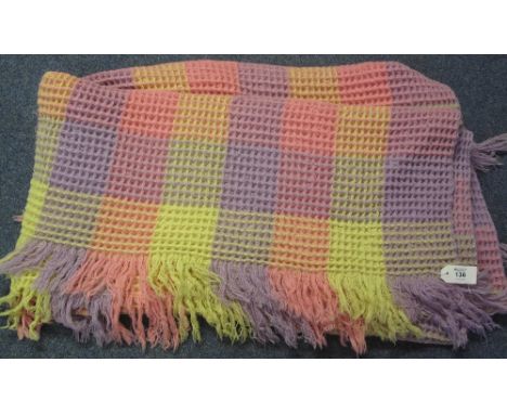 A multi-coloured check vintage honeycomb blanket with fringed edging, double size.(B.P. 24% incl. VAT)