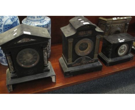 Two black slate and marble architectural two tone mantel clocks, together with another black slate and marble two train mante