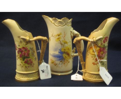 Pair of Royal Worcester peach ground tusk shaped jugs with floral decoration and stylised horn handles. Printed marks with sh