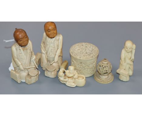 A Canton ivory box, three Japanese ivory or bone figures and an ivory netsuke