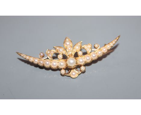 A yellow gold and split pearl set foliate crescent brooch, 54mm.