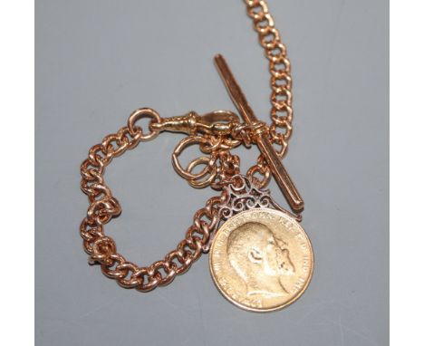 An 18ct gold curb-link watch chain with 1902 gold sovereign fob, gross 55.2 grams.