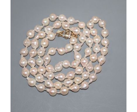 A modern single strand cultured baroque pearl necklace, with 9ct gold and diamond chip set clasp, 65cm