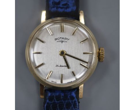 A lady's 9ct gold Rotary manual wind wrist watch, on associated blue leather strap.