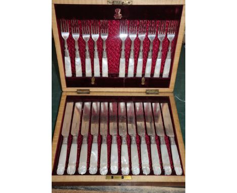 A set pearl handled dessert eaters (one fork missing)