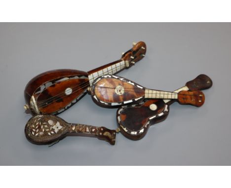 Four Italian tortoiseshell and mother of pearl models of mandolins and guitars