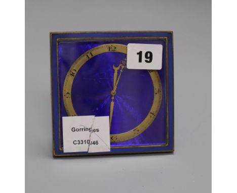 A brass and enamel strut timepiece height 11cm