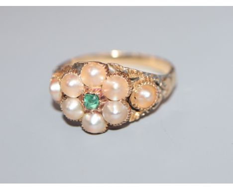 A late Victorian yellow metal, split pearl and emerald cluster dress ring, size K/L.