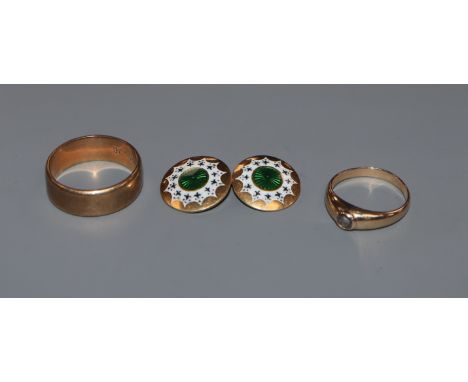 An 18ct gold and enamel cufflink (4.5g), a 9ct gold wedding band and a yellow metal ring (one missing stone)