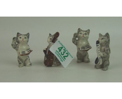 Beswick cats playing musical instruments from the cats quartet: comprising 1026 Conductor x 2, 1027 Cello player and 1029 Sax