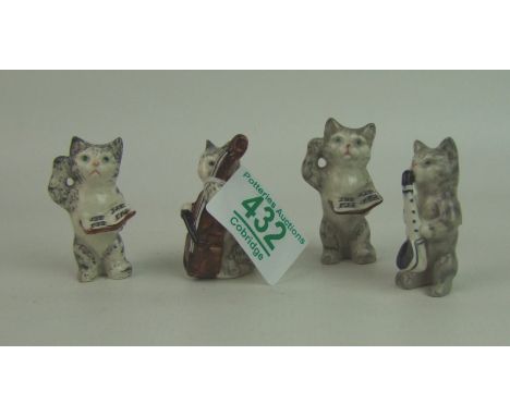 Beswick cats playing musical instruments from the cats quartet: comprising 1026 Conductor x 2, 1027 Cello player and 1029 Sax