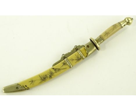 A Japanese carved bone and nickel miniature sword and scabbard, length 14cm.