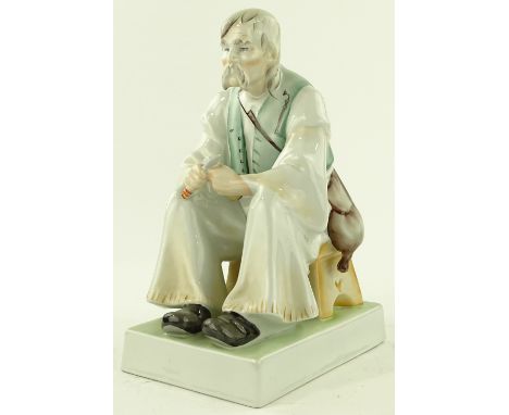 A Zsolnay porcelain seated figure, height 33cm.