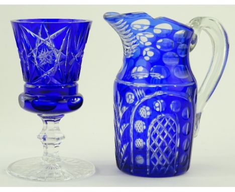 A blue overlay cut-glass jug, height 22cm and a similar blue overlay goblet, (2).