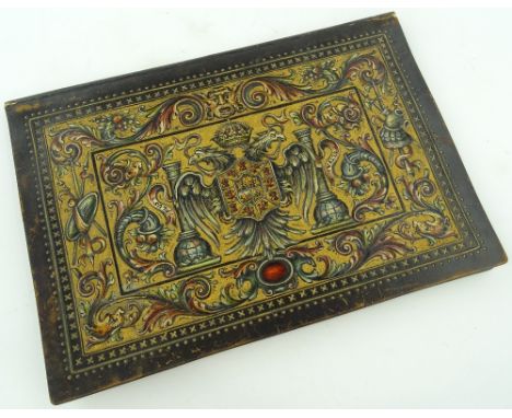 A continental embossed leather desk blotter with painted and gilded Spanish Royal Coat of Arms, 44cm x 30cm.