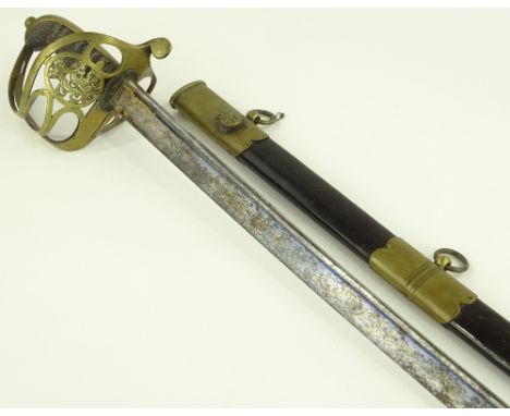 A Victorian Army Officer's sword, engraved blued and gilded blade, pierced brass bowl hilt with shagreen grips, original bras