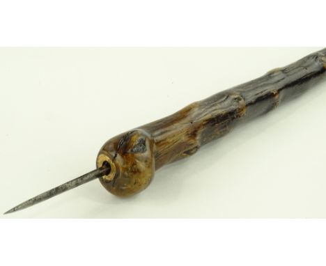 A late 19th century root wood flick stick, with concealed popup blade to the handle.