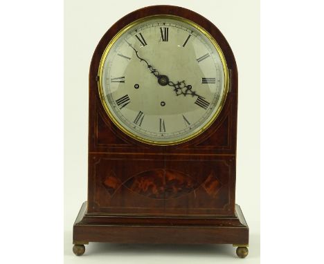 A mahogany domed top mantel clock, early 20th century with inlaid decoration, silvered dial and 8-day chiming movement, heigh