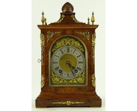 A good quality reproduction walnut cased bracket clock, early 20th century with ornate cast brass mouldings and mounts and 8-