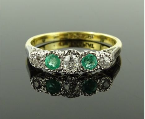 An 18ct gold and platinum 5 stone emerald and diamond ring, setting height 5mm, size R, 3.3g.