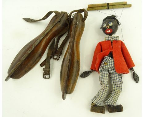 A Vintage Pelham puppet and a pair of Antique ice skates.