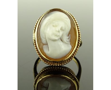 A 9ct gold carved Cameo set ring, depicting a portrait of a lady, setting height 22mm, size M, 4.7g.