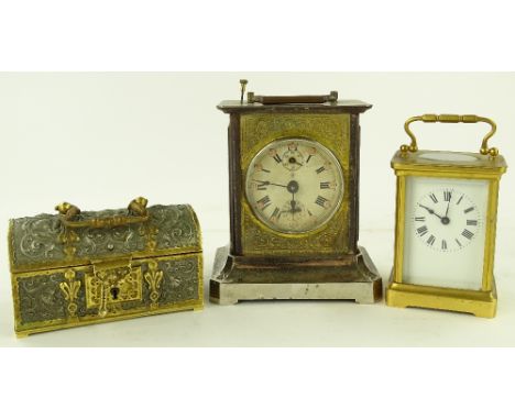 A French carriage clock, a Junghans alarm clock and a small gilt metal casket, (3).