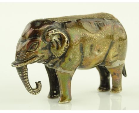 An Edwardian silver elephant pin cushion, circa 1900, hallmarks rubbed, length 4.5cm.
