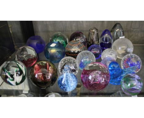 Eighteen Caithness paperweights, two Wedgwood paperweights, a globe paperweight and another formed as a dove