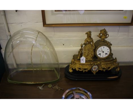 A French gilt metal table clock, with figure of a huntswoman next to the drum dial, on a foliate scrolling base, the Henry Ma