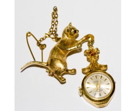 A 9 carat gold Rotary ladies pendant watch hanging from a 9 carat gold cat