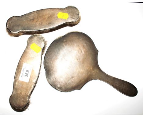 A ladies silver mirror and brush set, as found