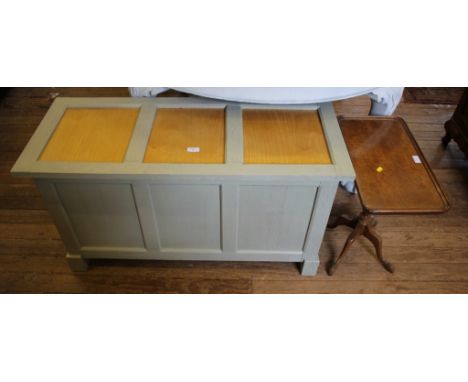 A painted triple panelled blanket box, with hinged lid, 104cm wide, and a small walnut tripod table (2)