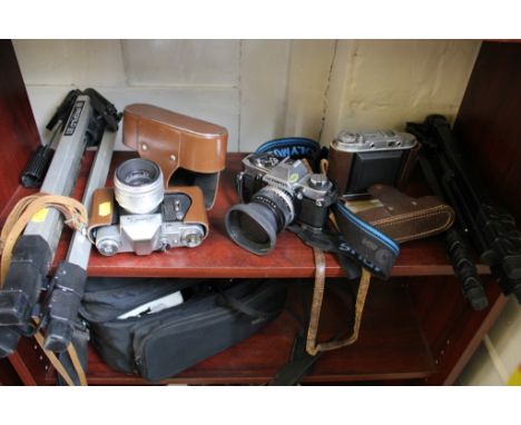 An Olympus OM20 SLR camera, a Minolta XD7 camera, Cokin filters and other accessories